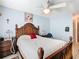 Bedroom featuring a wooden bed frame, bedside table, and soothing light blue walls for a calming retreat at 711 Lake Dexter Cir, Winter Haven, FL 33884