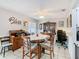 Dining area with tile flooring, wood furniture and natural light, offering a cozy and inviting space at 711 Lake Dexter Cir, Winter Haven, FL 33884
