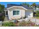 Lovely home boasting neat landscaping, a one car garage, and a welcoming entrance in a Gathering-friendly neighborhood at 711 Lake Dexter Cir, Winter Haven, FL 33884