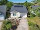 Charming home featuring a well-maintained lawn, solar panels, and inviting curb appeal in a desirable neighborhood at 711 Lake Dexter Cir, Winter Haven, FL 33884