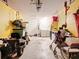 Functional garage space featuring laundry area, water heater, and ample storage for tools and equipment at 711 Lake Dexter Cir, Winter Haven, FL 33884