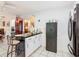 Kitchen with stainless steel appliances, bar seating, offering an open concept layout at 711 Lake Dexter Cir, Winter Haven, FL 33884