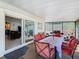 Cozy screened-in lanai offering a comfortable dining and seating area, perfect for enjoying the outdoors at 711 Lake Dexter Cir, Winter Haven, FL 33884