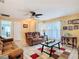 Bright living room featuring tile floors, comfortable seating, and neutral colors, perfect for relaxation at 711 Lake Dexter Cir, Winter Haven, FL 33884