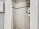 This tiled shower with sleek fixtures features a shower curtain and built-in shelving for organization at 711 Lake Dexter Cir, Winter Haven, FL 33884