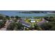 Aerial view showcasing the community layout, pool area, and scenic lake backdrop at 730 Druid St, Lakeland, FL 33805