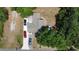 Bird's eye view of a single-story home with multiple cars parked in the driveway and street at 730 Druid St, Lakeland, FL 33805