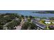 Aerial view of community featuring lush green space, lakeside views, and recreational facilities at 730 Druid St, Lakeland, FL 33805