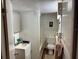 Functional bathroom features a sink, toilet, tiled walls, and shower-tub combination at 730 Druid St, Lakeland, FL 33805
