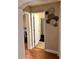 A view of the hall leading to the bathroom with decorative art on the wall at 730 Druid St, Lakeland, FL 33805