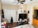 Nicely decorated bedroom with wood floors, ceiling fan, and a large closet for storage at 730 Druid St, Lakeland, FL 33805