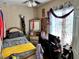 Simple bedroom with small bed, posters on the wall, and a ceiling fan at 730 Druid St, Lakeland, FL 33805