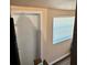 Modest bedroom with a window and closet space, offering essential living space at 730 Druid St, Lakeland, FL 33805