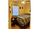 Bedroom featuring ceiling fan, hardwood floor, and simple decor at 730 Druid St, Lakeland, FL 33805