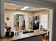 Spacious kitchen with stainless steel sink, refrigerator, and a partial view into the living room at 730 Druid St, Lakeland, FL 33805
