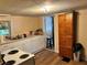 Functional kitchen with white cabinets and appliances, wood-look flooring, and storage solutions at 730 Druid St, Lakeland, FL 33805