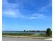 Scenic lake view with lush vegetation and clear skies, perfect for nature lovers at 730 Druid St, Lakeland, FL 33805