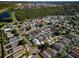 Aerial view showcasing a dense residential area with homes nestled among lush greenery, creating a serene environment at 8001 Arrow Creek Rd, Kissimmee, FL 34747