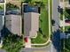 An aerial shot displays a property with lush landscaping and a well-maintained backyard, offering privacy and charm at 8001 Arrow Creek Rd, Kissimmee, FL 34747