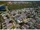 Aerial view showcasing a dense residential area with homes nestled among lush greenery, creating a serene environment at 8001 Arrow Creek Rd, Kissimmee, FL 34747