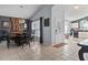 Open dining area with decorative lighting and an adjacent entryway provides an inviting atmosphere at 8001 Arrow Creek Rd, Kissimmee, FL 34747