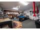 Spacious game room with a pool table, foosball table, and ample space for entertainment at 8001 Arrow Creek Rd, Kissimmee, FL 34747