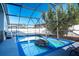 Inviting screened pool with a unique rock feature, perfect for relaxing and entertaining in a private setting at 8001 Arrow Creek Rd, Kissimmee, FL 34747