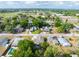 Aerial view of the home and neighborhood showcasing its location among mature trees at 806 Avenue G Ne, Winter Haven, FL 33881