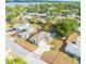 Aerial view of property showcasing the house, yard, and neighborhood with red boundary lines at 806 Avenue G Ne, Winter Haven, FL 33881