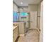 Elegant bathroom showcasing a frameless glass shower, tile flooring, and vanity with countertop at 806 Avenue G Ne, Winter Haven, FL 33881