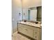 Elegant bathroom featuring a double sink vanity with marble countertop and modern fixtures at 806 Avenue G Ne, Winter Haven, FL 33881