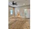 Spacious bedroom with neutral tones, ceiling fan, and connecting bathroom and closet at 806 Avenue G Ne, Winter Haven, FL 33881