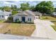 Charming single-story home with a blue front door and a well-maintained lawn at 806 Avenue G Ne, Winter Haven, FL 33881