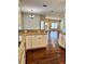Elegant kitchen with white cabinets, granite counters, and a view into the living room at 806 Avenue G Ne, Winter Haven, FL 33881