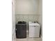 Laundry room equipped with a modern washer and dryer, and wire shelving at 806 Avenue G Ne, Winter Haven, FL 33881