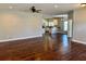 View of the open-concept living room featuring hardwood floors at 806 Avenue G Ne, Winter Haven, FL 33881