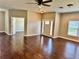Open-concept living space with gleaming wood floors and natural light at 806 Avenue G Ne, Winter Haven, FL 33881
