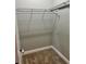 Compact walk-in closet with wire shelving and carpeted flooring, perfect for storage at 806 Avenue G Ne, Winter Haven, FL 33881