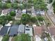 An aerial view shows the location of a neighborhood, the houses have pools and solar panels at 9430 Daney St, Gotha, FL 34734