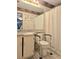 Bathroom with mobility aides, and shower curtain, featuring granite counters and vanity at 9430 Daney St, Gotha, FL 34734
