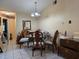 Cozy dining area featuring traditional furniture, a chandelier, and tile floors at 9430 Daney St, Gotha, FL 34734