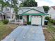 Charming single-Gathering home with a welcoming front porch and attached garage and solar at 9430 Daney St, Gotha, FL 34734