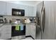 Modern kitchen with stainless steel appliances and ample counter space at 9430 Daney St, Gotha, FL 34734