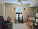 Casual living room area with a ceiling fan, entertainment center, and comfortable seating at 9430 Daney St, Gotha, FL 34734