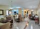 Spacious living room with tile flooring, chandelier lighting, and an open layout at 9430 Daney St, Gotha, FL 34734