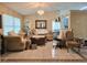 Bright living room with elegant decor, comfortable seating, and a decorative mirror at 9430 Daney St, Gotha, FL 34734