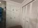 Bathroom door and cabinetry that provide ample storage at 104 Woden Way, Winter Haven, FL 33884