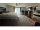 Bedroom with an upholstered bed and a large patterned rug at 104 Woden Way, Winter Haven, FL 33884