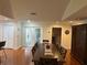 Elegant dining room featuring a large table, wood floors, and stylish decor at 104 Woden Way, Winter Haven, FL 33884