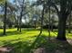 Lush community green space with mature trees providing ample shade at 104 Woden Way, Winter Haven, FL 33884